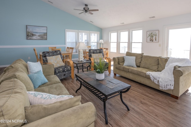 living room with ceiling fan, dark wood-type flooring, and high vaulted ceiling