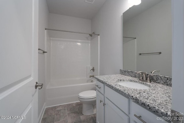 full bathroom featuring vanity, bathing tub / shower combination, and toilet