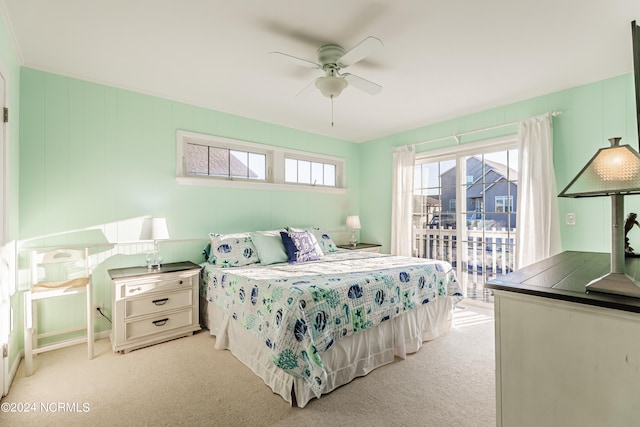 bedroom with ceiling fan, light colored carpet, and access to outside