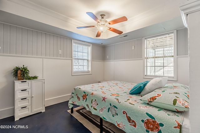 bedroom with ceiling fan and crown molding