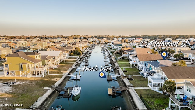 aerial view at dusk with a water view