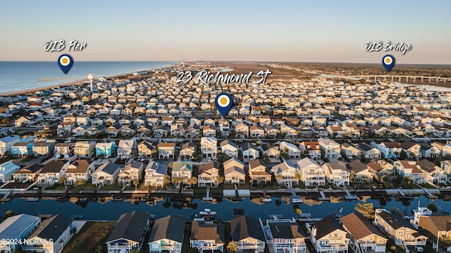 aerial view at dusk with a water view