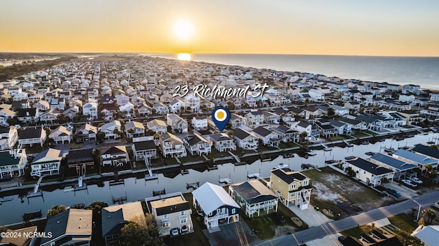 aerial view at dusk with a water view