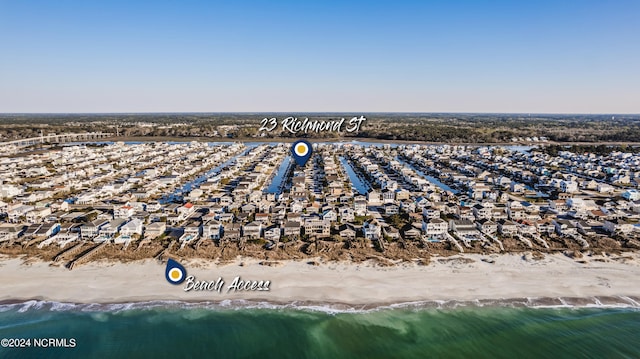 bird's eye view featuring a beach view and a water view