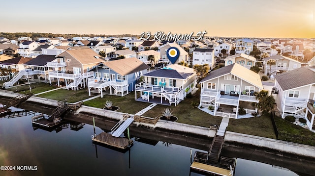 aerial view at dusk with a water view