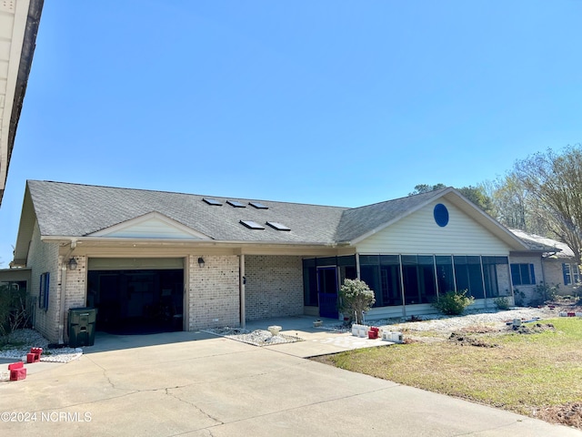 single story home featuring a garage