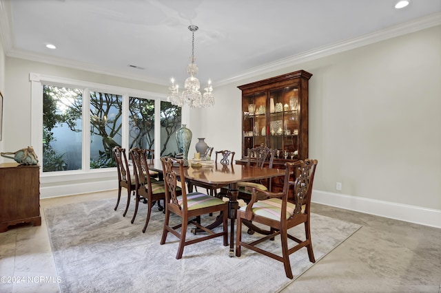 dining space with an inviting chandelier and ornamental molding