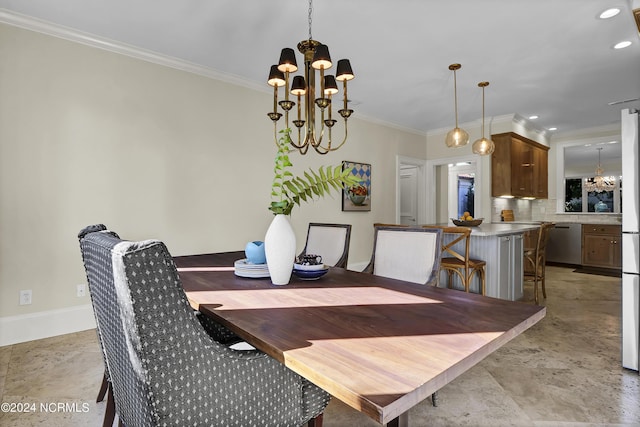 dining room featuring ornamental molding and a chandelier