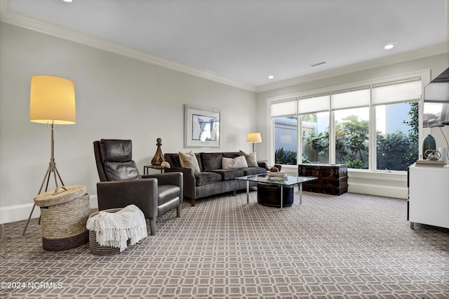 living room featuring ornamental molding and carpet flooring