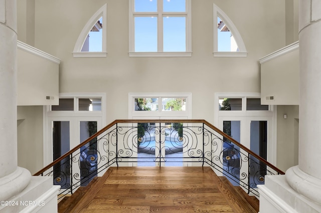 stairway featuring a high ceiling