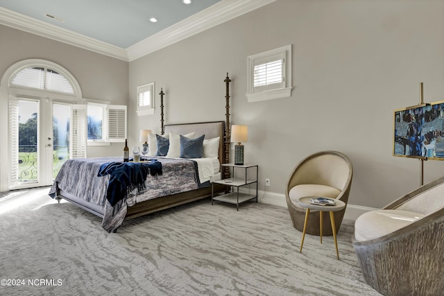 bedroom featuring multiple windows, crown molding, access to outside, and carpet