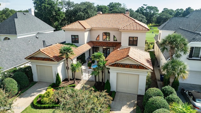 mediterranean / spanish-style house featuring a garage