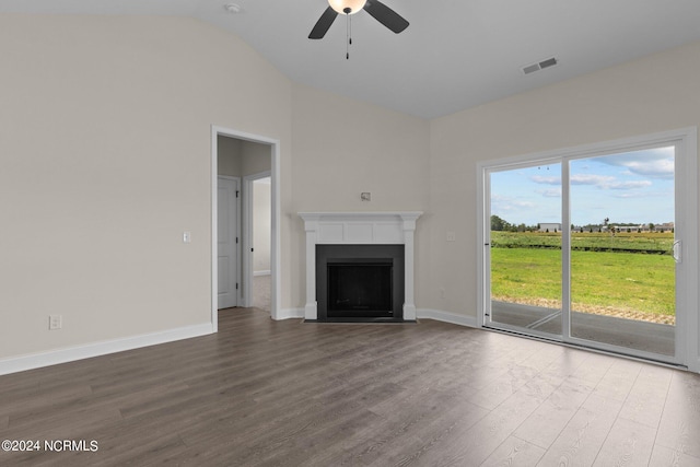 unfurnished living room featuring ceiling fan, hardwood / wood-style floors, and vaulted ceiling