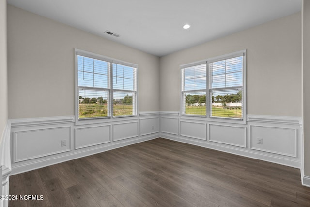 unfurnished room featuring dark hardwood / wood-style floors