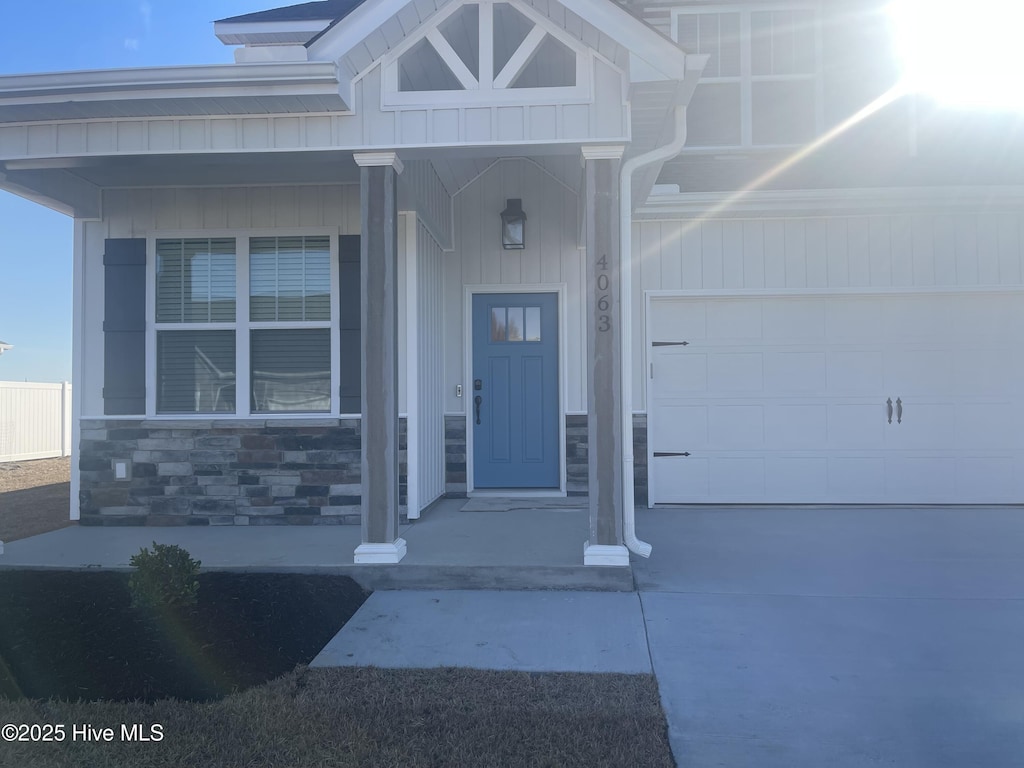 doorway to property with a garage