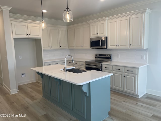 kitchen featuring backsplash, stainless steel appliances, hanging light fixtures, and sink