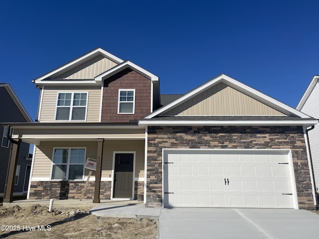 craftsman-style house with covered porch and a garage