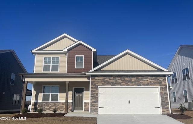 craftsman house featuring a porch and a garage