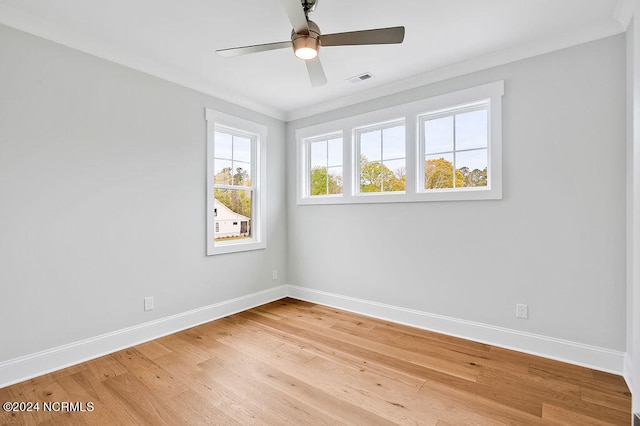 spare room with ceiling fan, crown molding, and light hardwood / wood-style floors