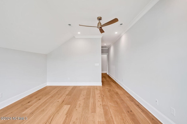 additional living space featuring ceiling fan, light wood-type flooring, and vaulted ceiling