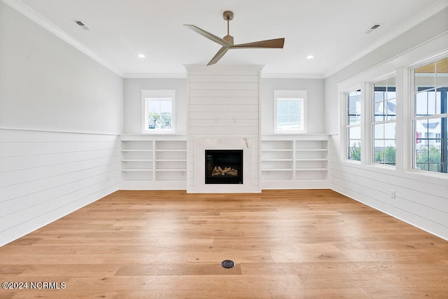 unfurnished living room featuring ceiling fan, light hardwood / wood-style floors, and plenty of natural light