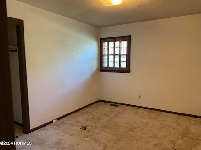 empty room featuring a textured ceiling