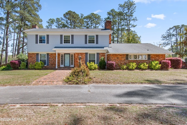 view of front of property with a front lawn