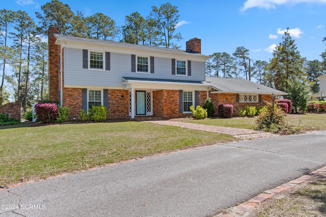 view of property with a front lawn