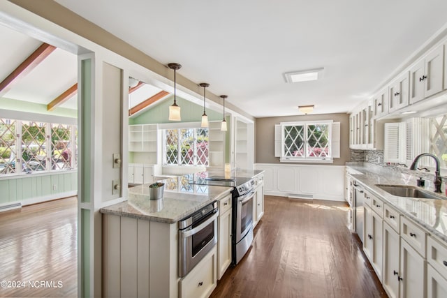 kitchen featuring white cabinetry, dark wood-type flooring, sink, and a wealth of natural light