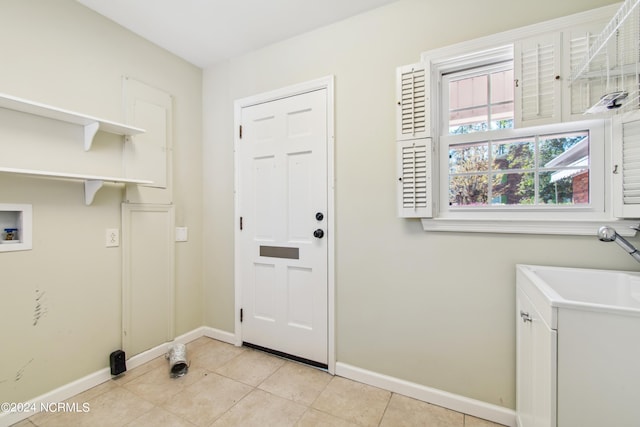 laundry room with light tile floors and hookup for a washing machine