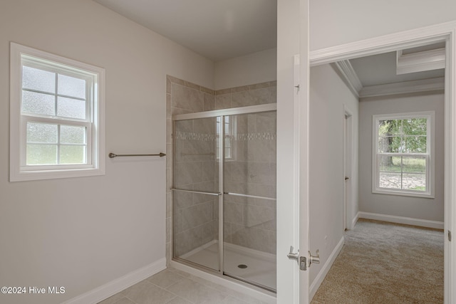 bathroom featuring tile patterned floors, a healthy amount of sunlight, and walk in shower