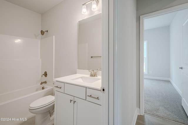 full bathroom with wood-type flooring, vanity, shower / bath combination, and toilet