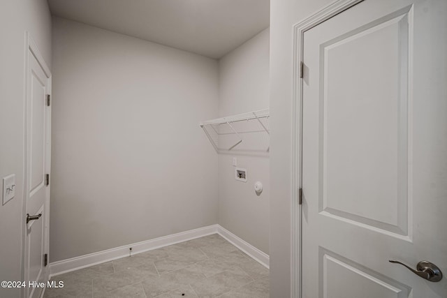 laundry room featuring light tile patterned floors and hookup for a washing machine