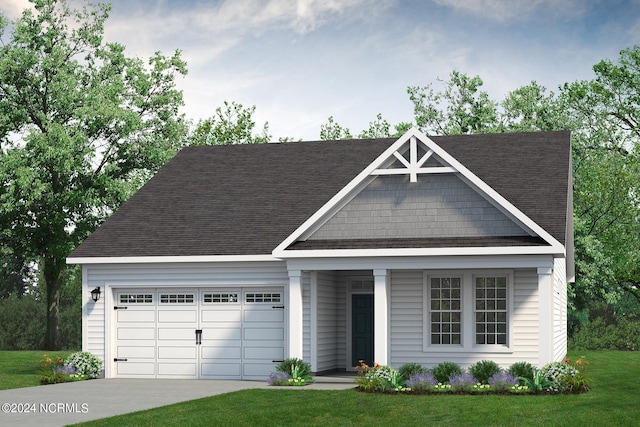 craftsman-style house featuring a front yard and a garage