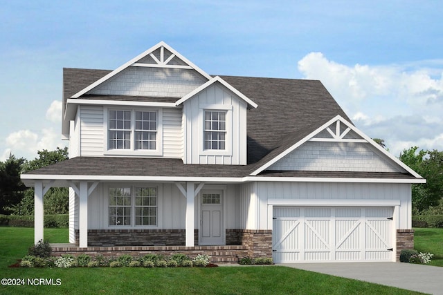 craftsman-style house featuring a garage and a front yard