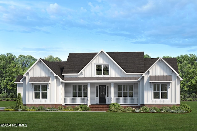 modern inspired farmhouse featuring covered porch and a front yard