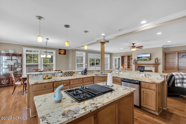 kitchen with dishwasher, light stone counters, hanging light fixtures, and ornamental molding