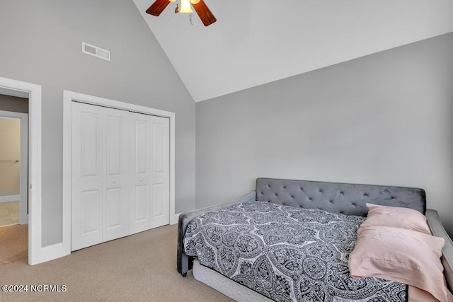 bedroom with carpet, ceiling fan, high vaulted ceiling, and a closet