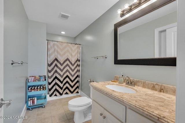 bathroom featuring tile patterned flooring, vanity, curtained shower, and toilet