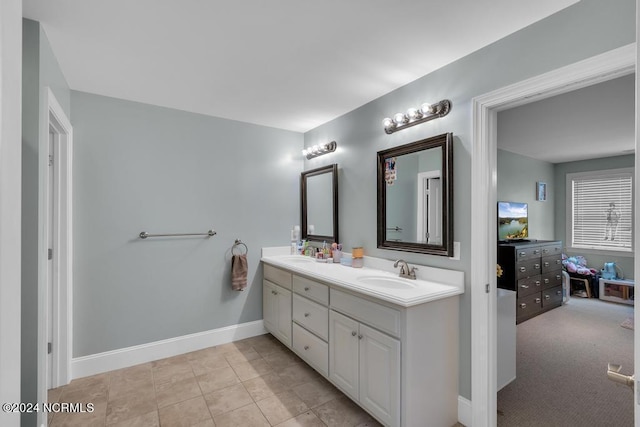 bathroom featuring tile patterned flooring and vanity