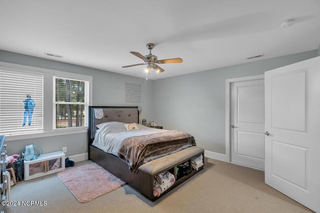 carpeted bedroom with ceiling fan