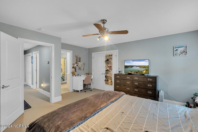 bedroom with ceiling fan and light colored carpet