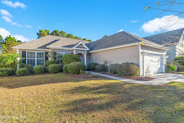 single story home with a garage and a front yard