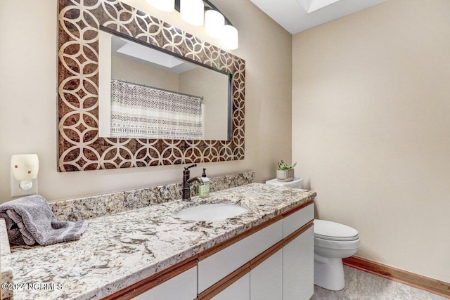 bathroom featuring toilet, tile floors, and oversized vanity