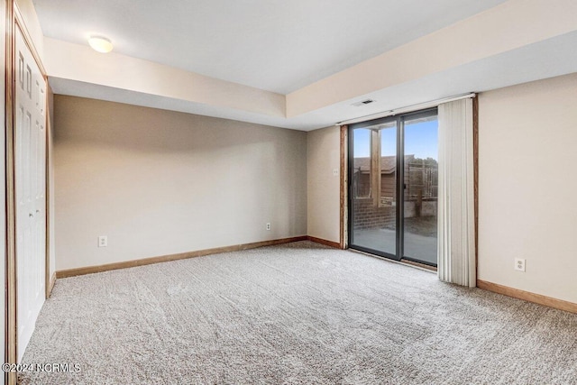 unfurnished room featuring light colored carpet