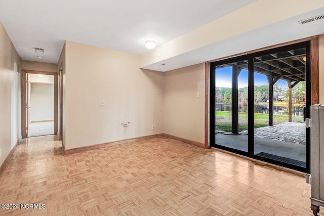 spare room with light parquet floors