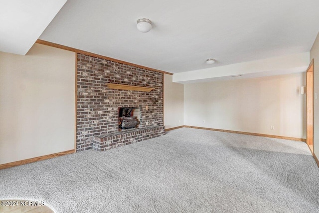 unfurnished living room featuring light carpet, brick wall, a wood stove, and a brick fireplace