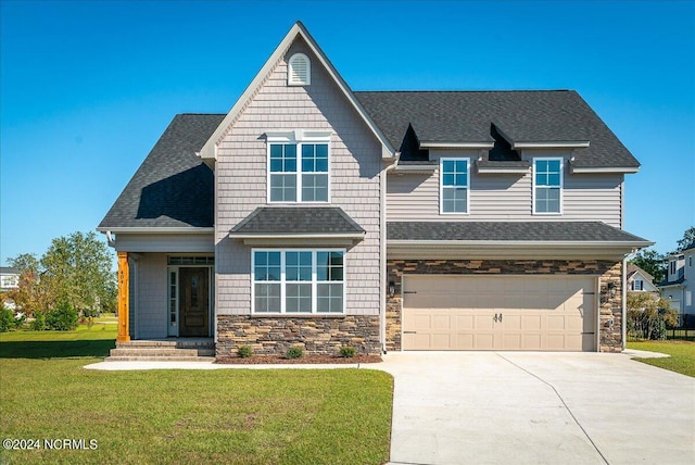 view of front facade with a front lawn and a garage