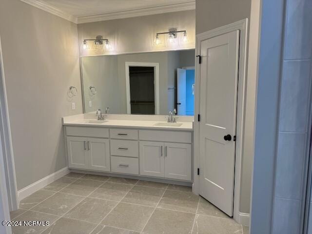 bathroom featuring ornamental molding, tile patterned flooring, and vanity