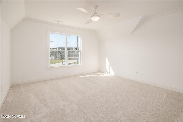 bonus room featuring ceiling fan, vaulted ceiling, and light carpet